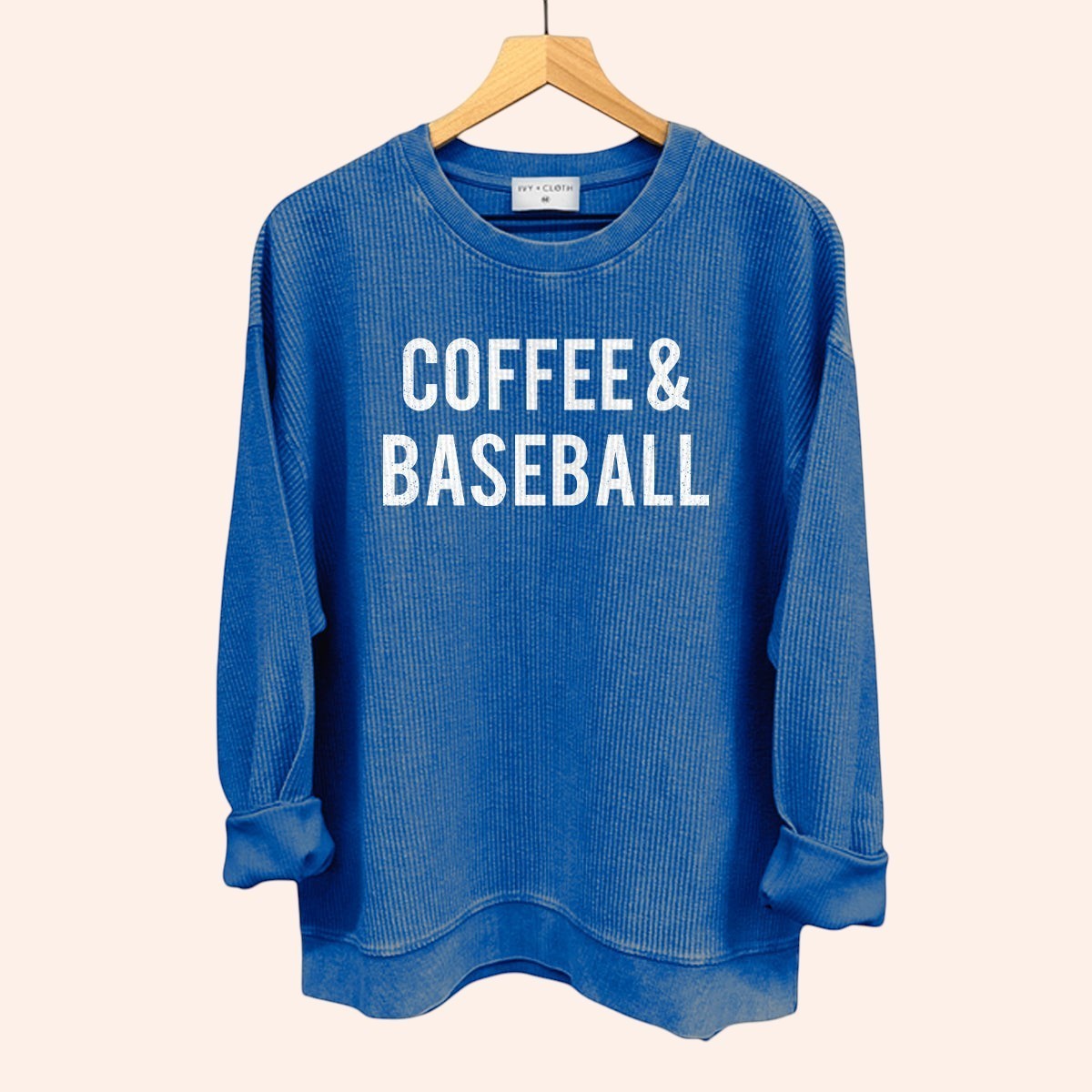 Bleacher Babe blue waffle knit crewneck sweatshirt with "COFFEE & BASEBALL" graphic print.