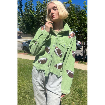 Football sequin corduroy jackets hanging on a rack