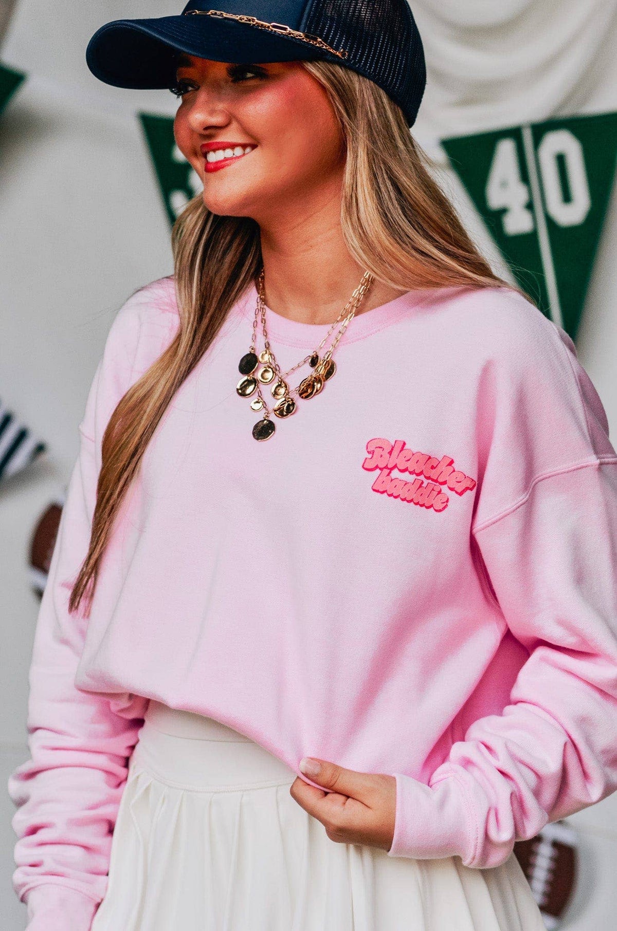Bleacher Baddie light pink game day sweatshirt with bubble letter graphic