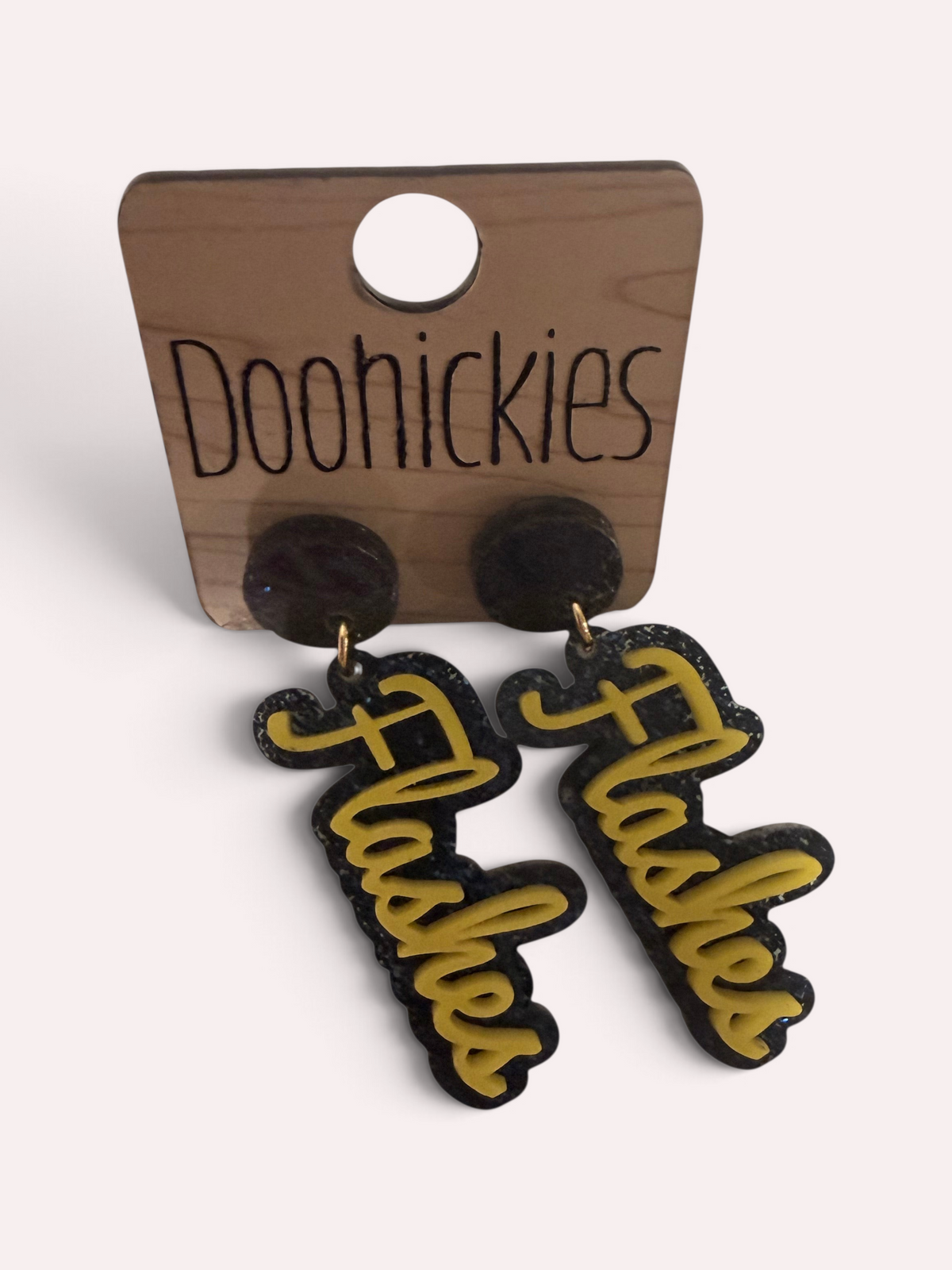 Florence Flashes script earrings in gold acrylic over navy glitter, handmade game day spirit earrings