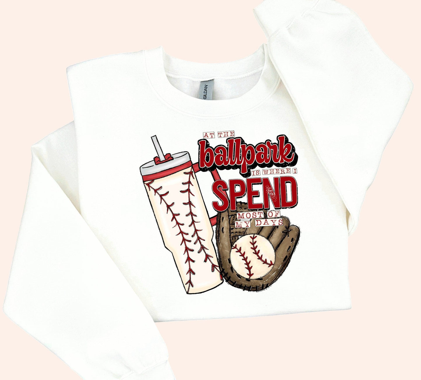 Bleacher Babe white crewneck sweatshirt with baseball graphic and text "At the ballpark is where I spend most of my days."