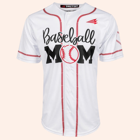 Bleacher Babe white baseball jersey with red stitching and "Baseball MOM" graphic. Lightweight fabric, lifestyle cut.