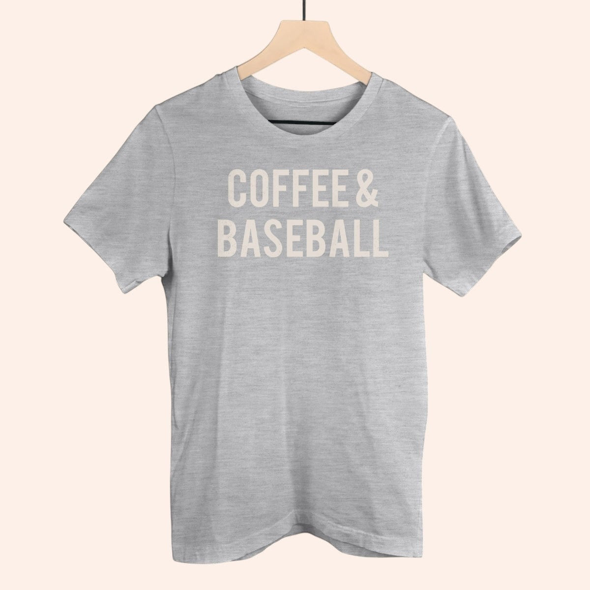 Bleacher Babe grey cotton t-shirt with "COFFEE & BASEBALL" text graphic. Casual everyday wear.