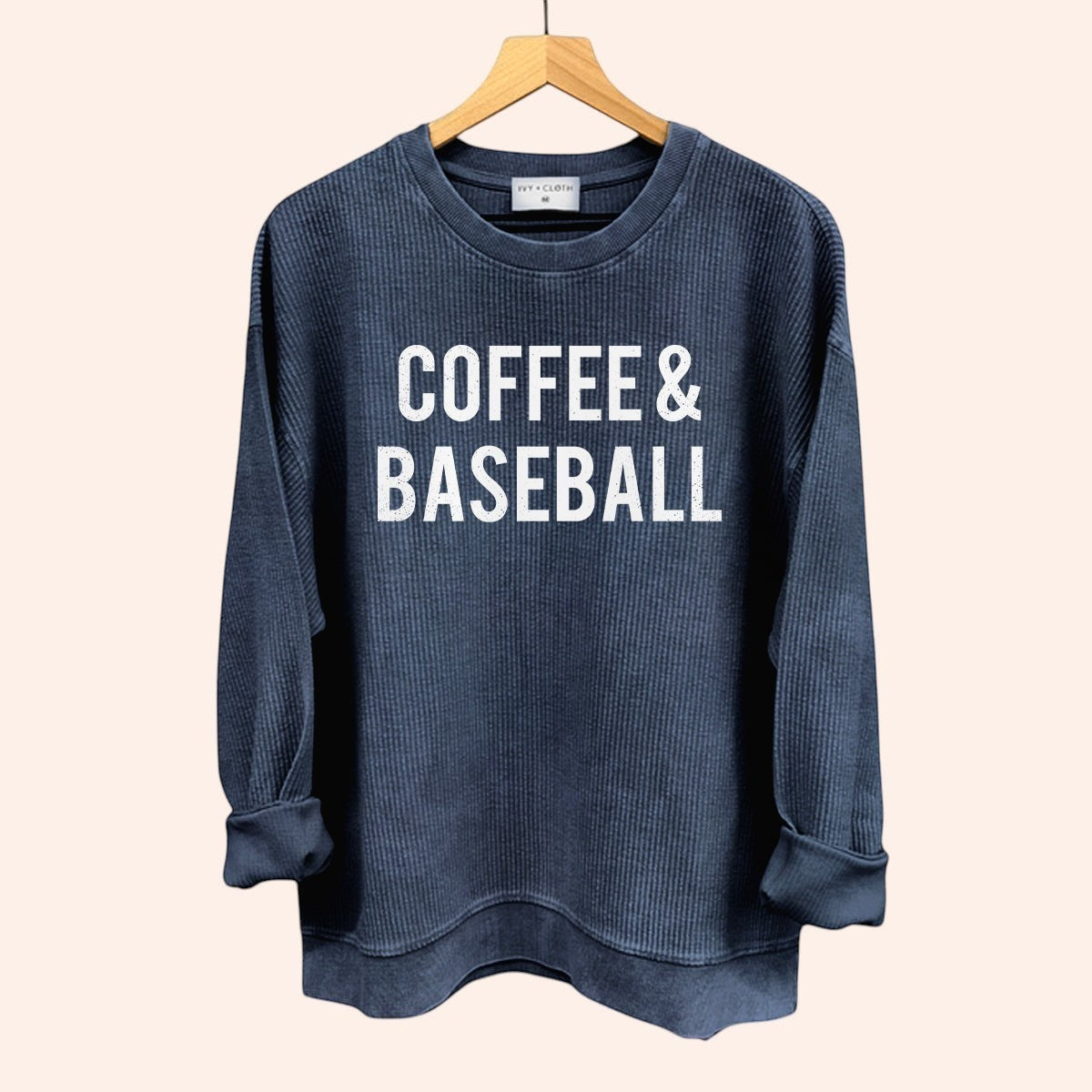 Bleacher Babe navy blue waffle knit crewneck sweatshirt with "COFFEE & BASEBALL" graphic print.