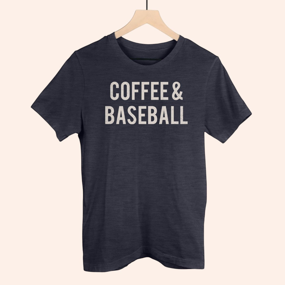 Bleacher Babe navy blue t-shirt with "COFFEE & BASEBALL" graphic print in white distressed font.