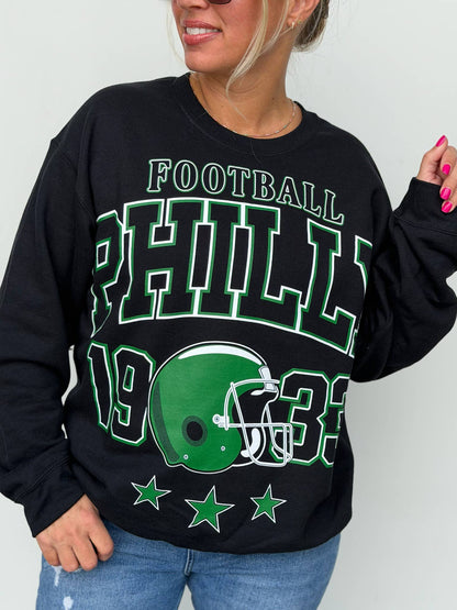 Bleacher Babe black unisex sweatshirt featuring a vintage style green and white Philly football graphic print