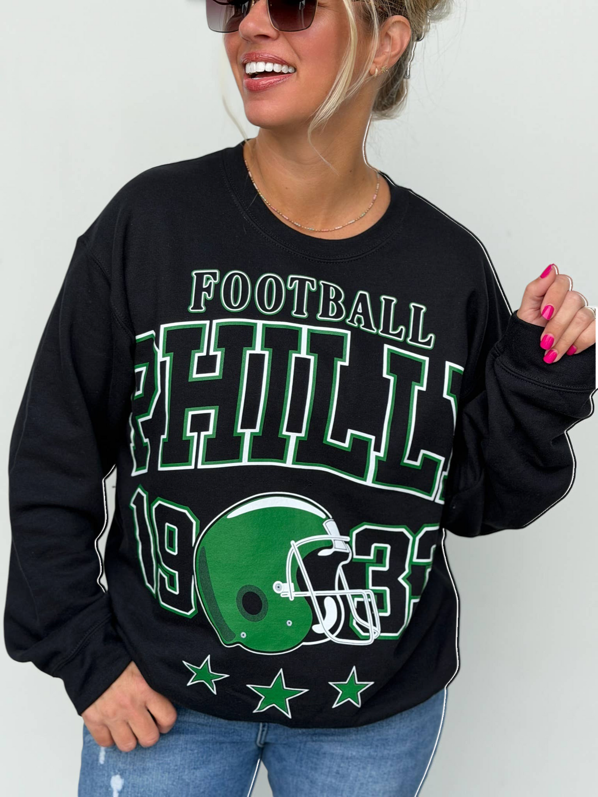 Bleacher Babe black unisex sweatshirt with green and white Philly football screen print and helmet graphic