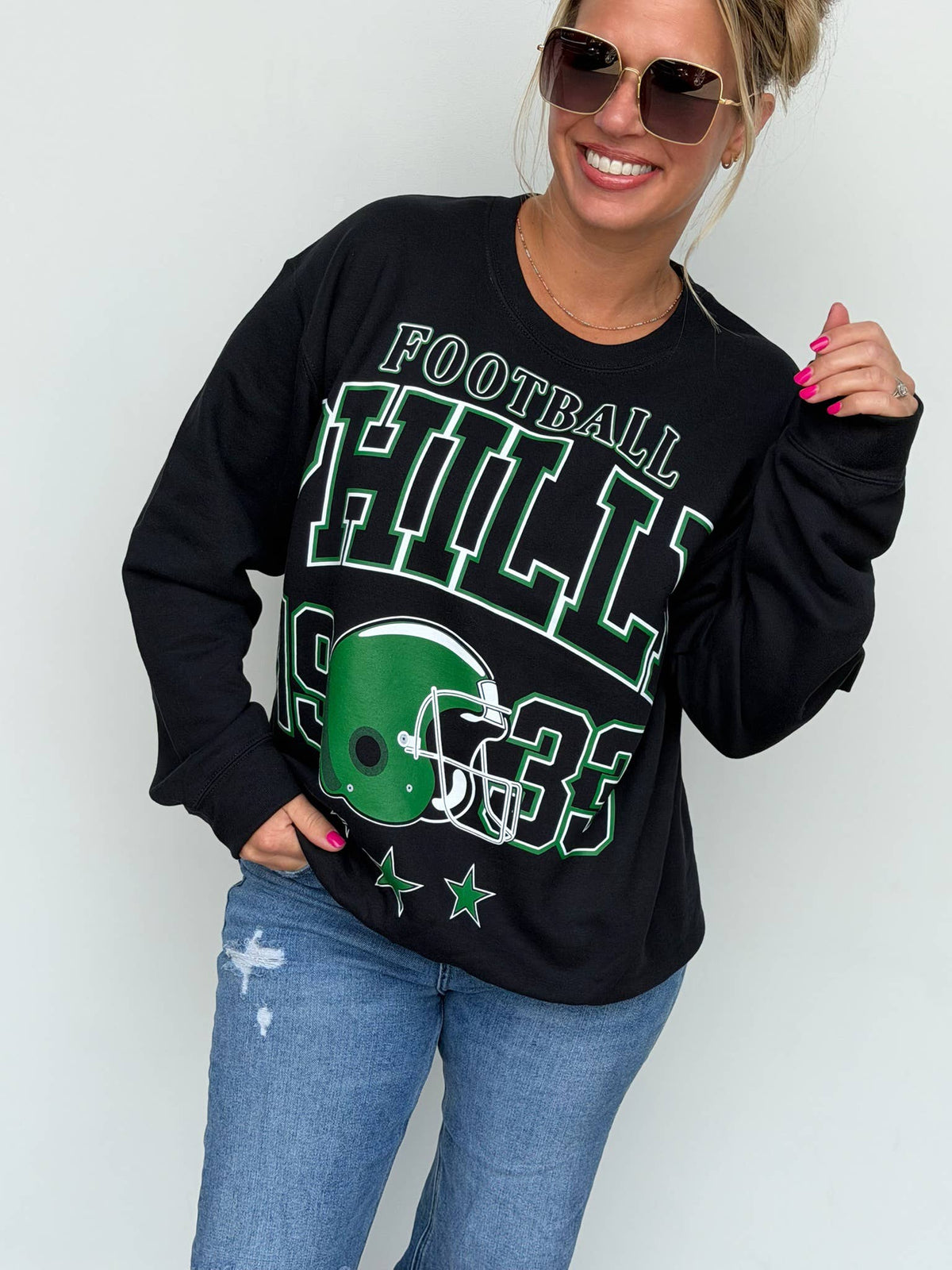 Bleacher Babe black unisex oversized sweatshirt with green and white vintage football screen print graphic