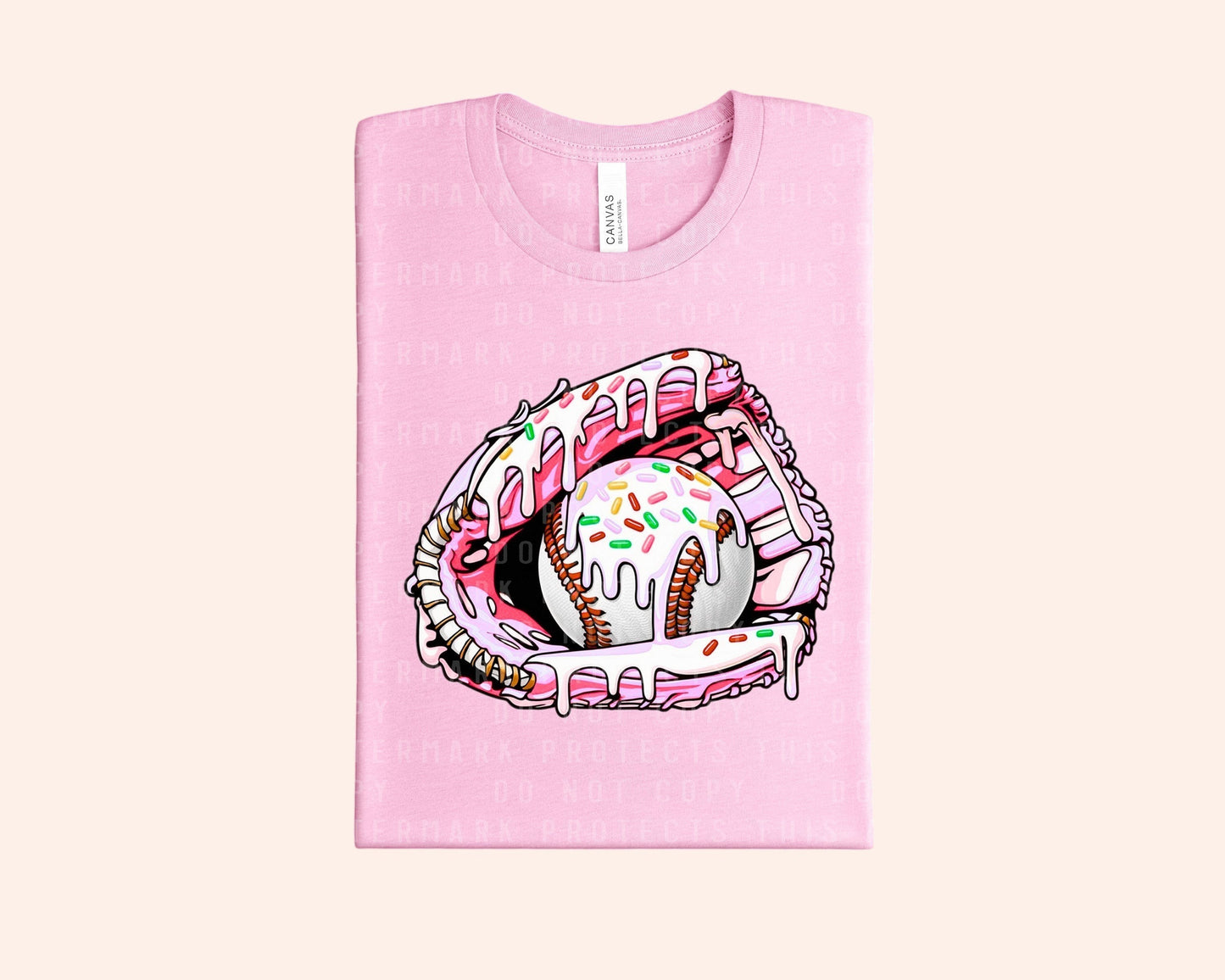 Bleacher Babe pink graphic tee with a baseball glove holding a baseball covered in pink frosting and sprinkles.