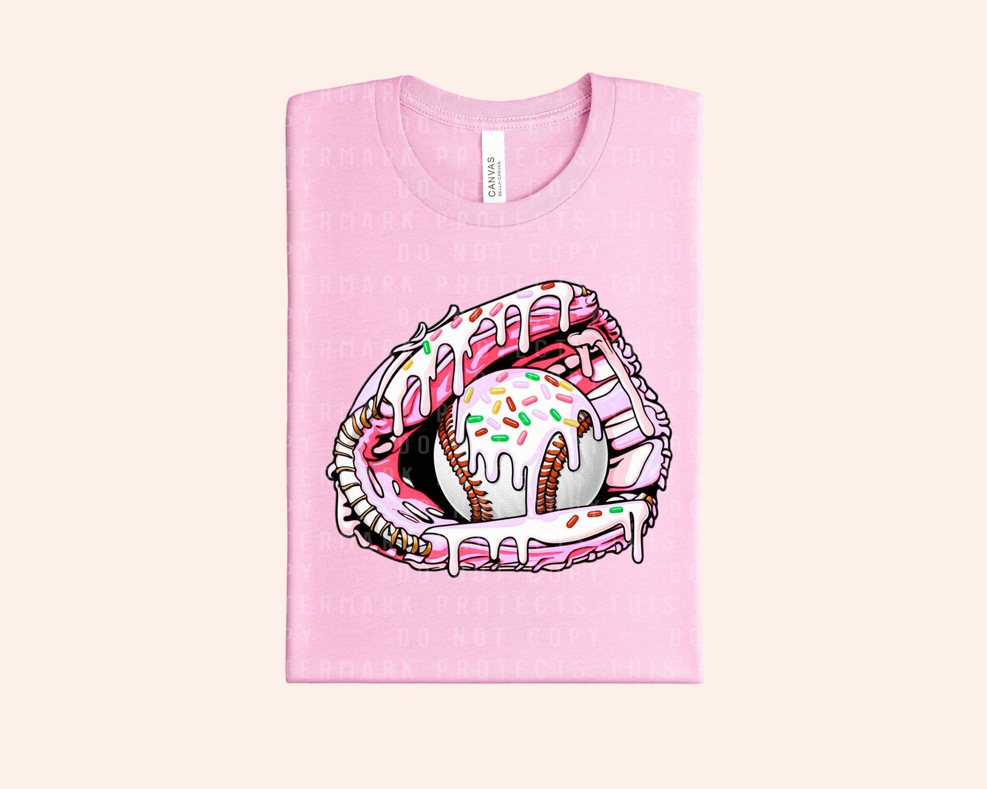 Bleacher Babe pink graphic tee with a baseball glove holding a baseball covered in pink frosting and sprinkles.