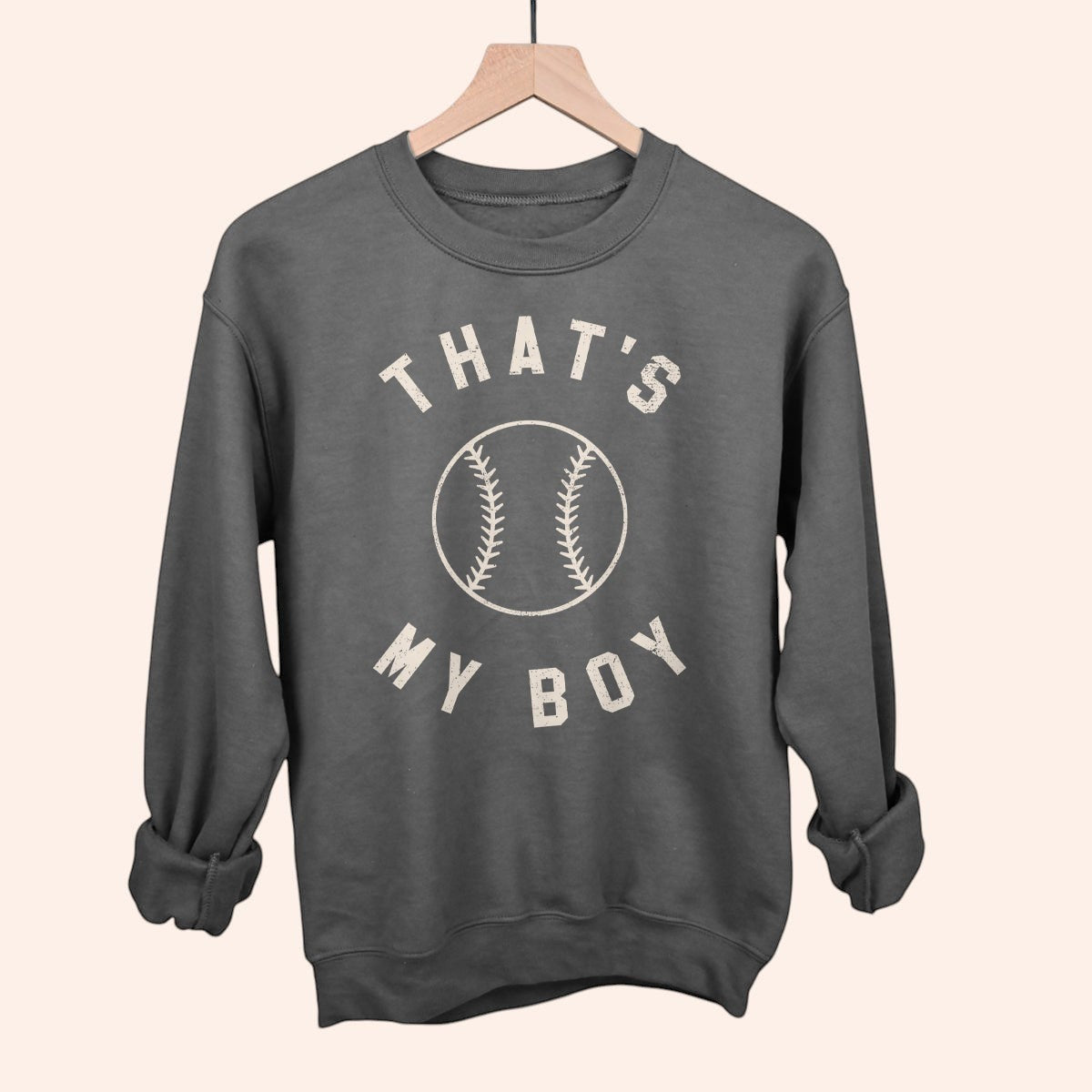 Bleacher Babe dark grey crewneck sweatshirt with "THAT'S MY BOY" and baseball graphic. Perfect for game day.