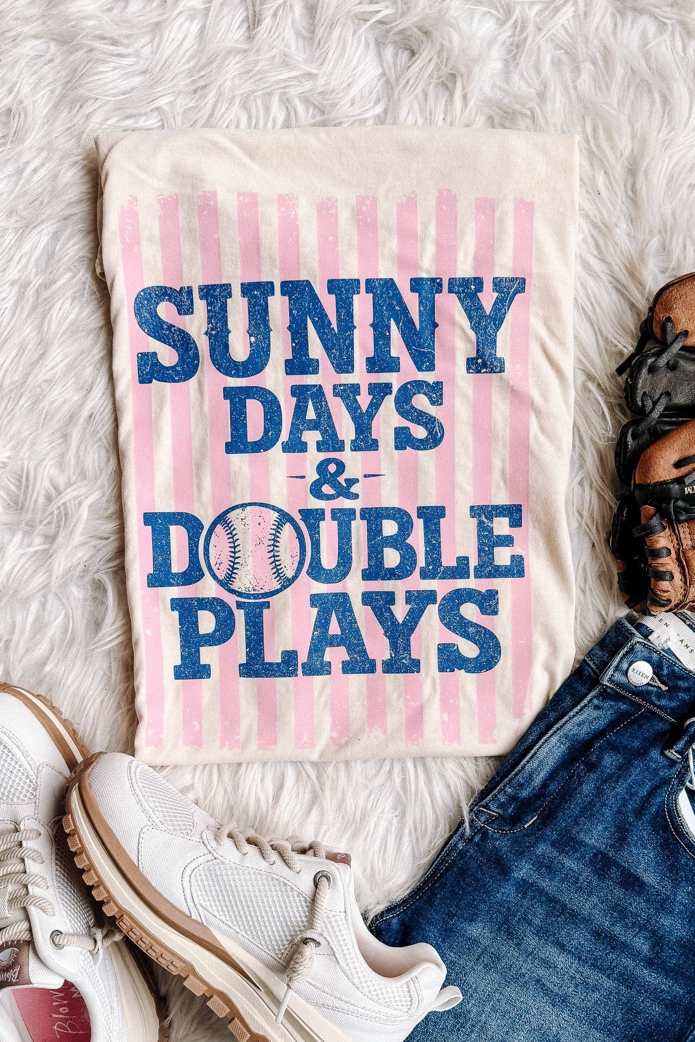 Close-up of Sunny Days & Double Plays graphic on ivory Comfort Colors baseball tee with glove
