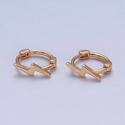 Gold lightning bolt huggie hoop earrings by Aim Eternal – dainty pair on light background