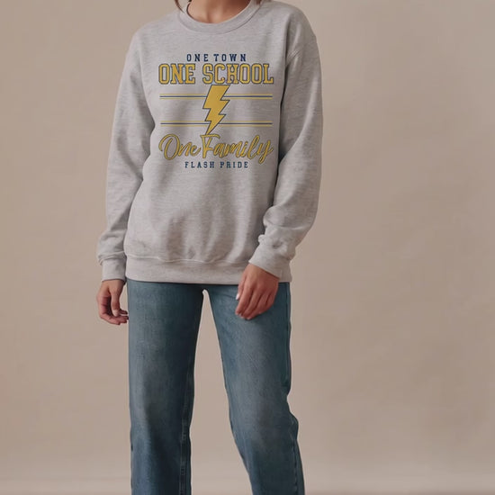 Model wearing the heather gray One Town One School One Family Flash Pride crewneck sweatshirt